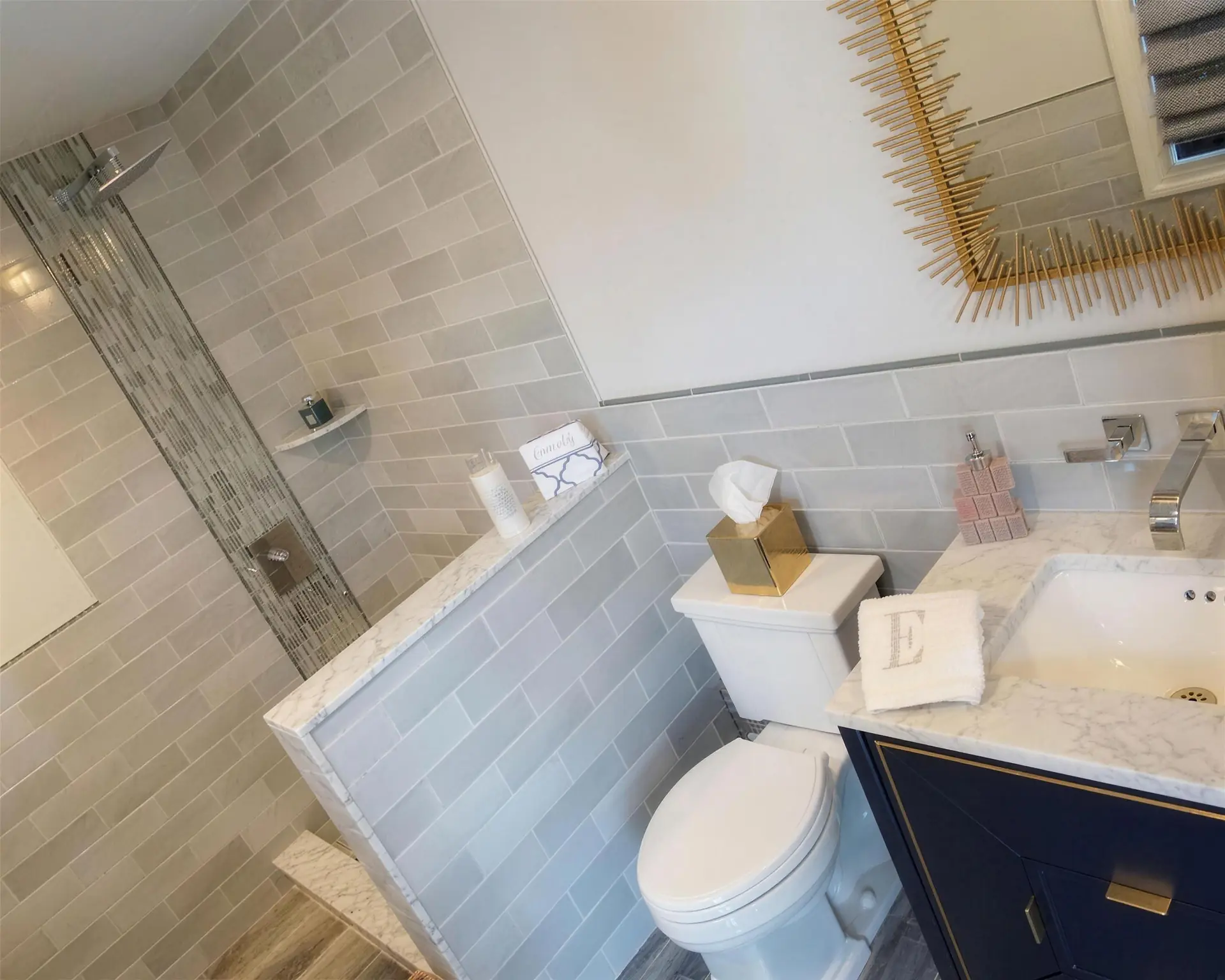 A finished custom bathroom, tiled floor to ceiling
